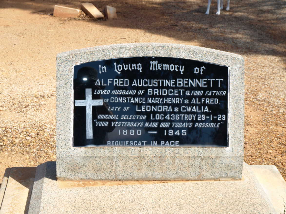 This is a photograph of a memorial plaque dedicated to Alfred Augustine BENNETT