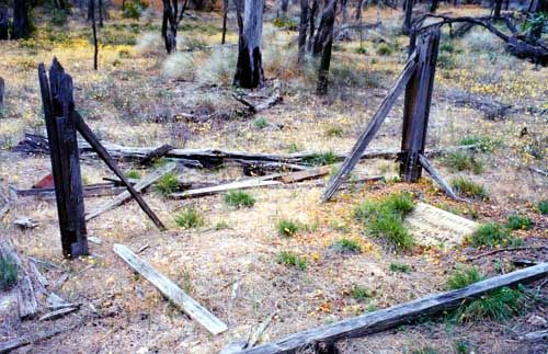 This is an old photo of the dilapidated fence of Benjamin Spencer's grave